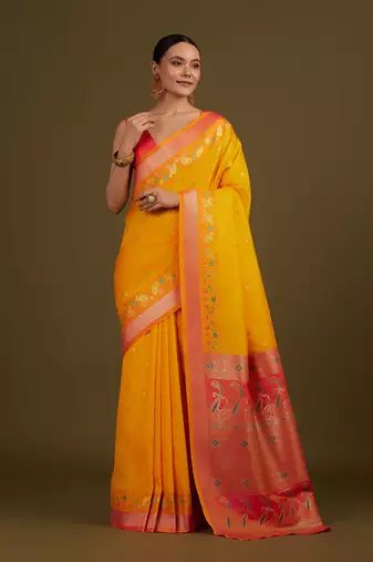 Yellow banarasi silk blend saree with paisley zari pallu