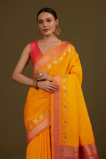 Yellow banarasi silk blend saree with paisley zari pallu