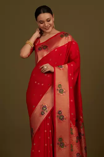 Red woven silk blend saree with floral motifs zari work