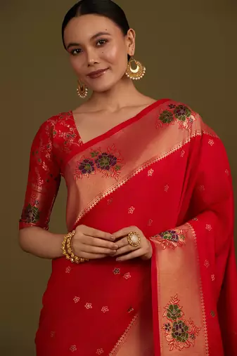 Red woven silk blend saree with floral motifs zari work