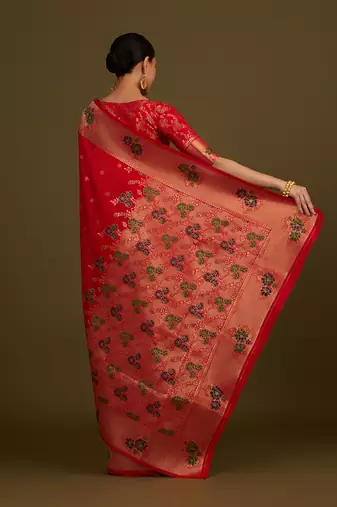 Red woven silk blend saree with floral motifs zari work