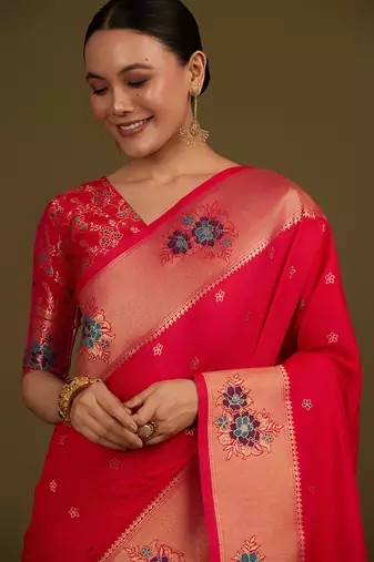 Pink woven silk blend saree with floral motifs zari work