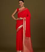 Red woven silk blend saree with floral motifs zari work & unstitched blouse piece