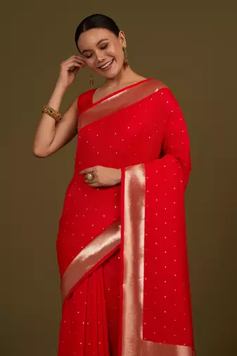 Red woven silk blend saree with floral motifs zari work