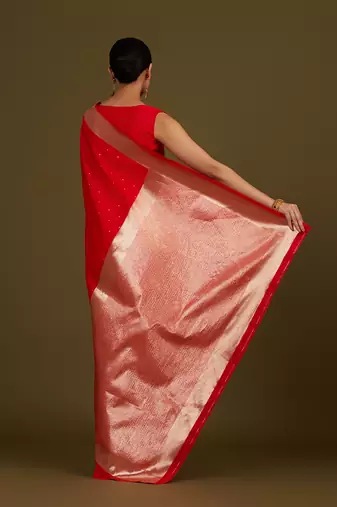 Red woven silk blend saree with floral motifs zari work