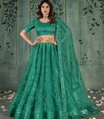 LIGHT GREEN SEQUINS THREAD EMBROIDERED SOFT NET SEMI STITCHED LEHENGA CHOLI