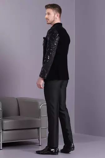 Black velvet jodhpuri suit with floral sequins work on sleeves