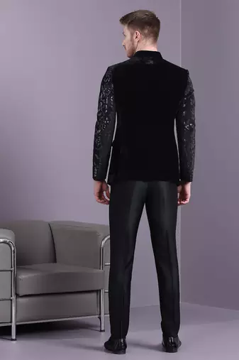 Black velvet jodhpuri suit with floral sequins work on sleeves