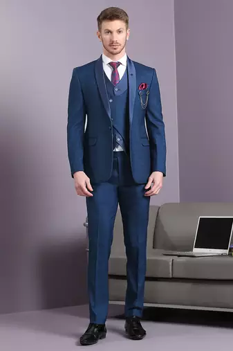 Blue self design suit with same fabric waistcoat