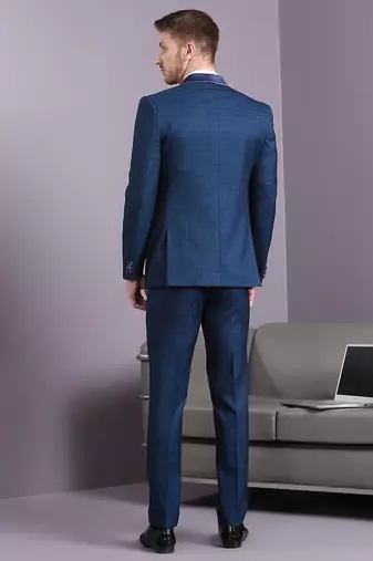 Blue self design suit with same fabric waistcoat