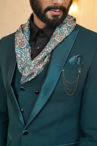 Peacock green suit with scarf attached waistcoats