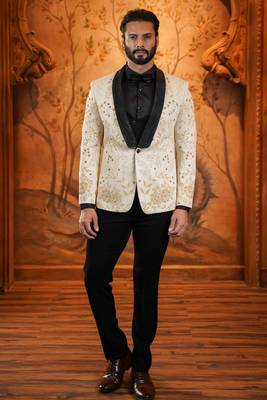 Cream suede suit with floral engraving and hand embroidery highlights 1