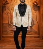 Cream suede suit with floral engraving and hand embroidery highlights