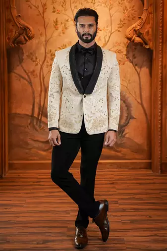 Cream suede suit with floral engraving and hand embroidery highlights
