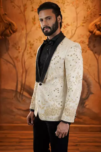 Cream suede suit with floral engraving and hand embroidery highlights
