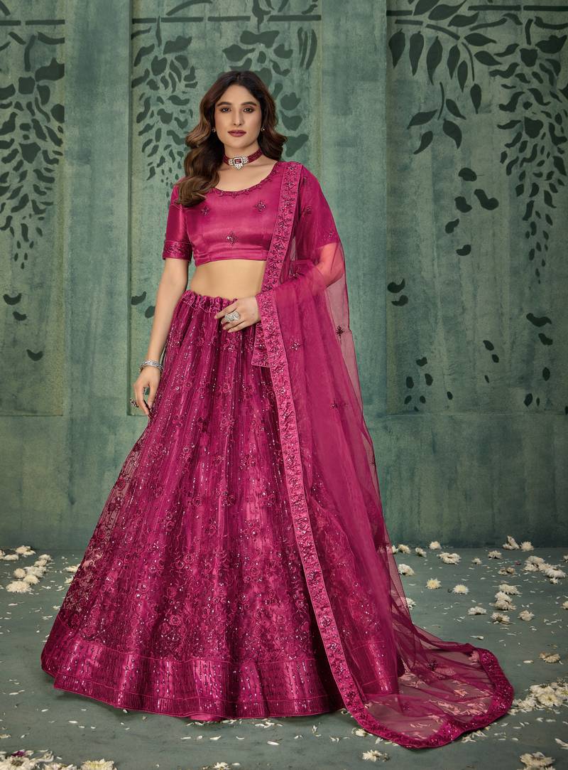 MAGENTA PINK SEQUINS THREAD EMBROIDERED SOFT NET SEMI STITCHED LEHENGA CHOLI