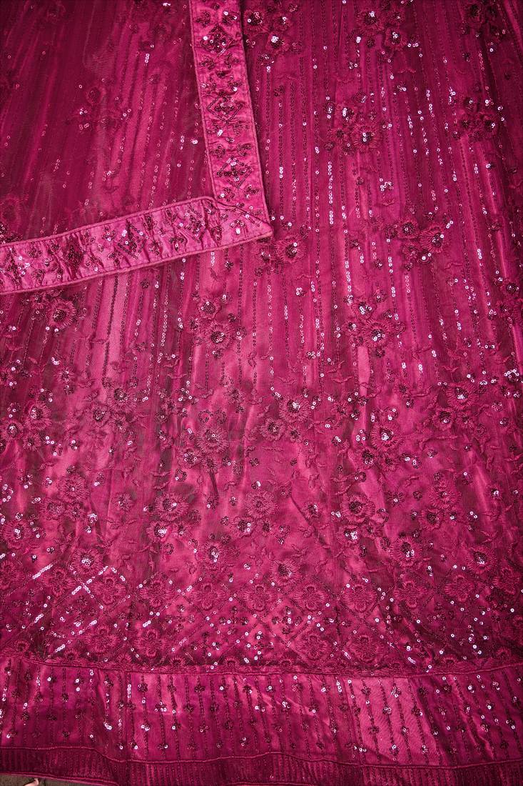 MAGENTA PINK SEQUINS THREAD EMBROIDERED SOFT NET SEMI STITCHED LEHENGA CHOLI