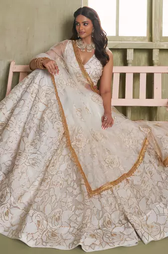 OFF WHITE NET FABRIC LAHENGA CHOLI WITH SEQUINS AND THREAD EMBROIDERY WORK