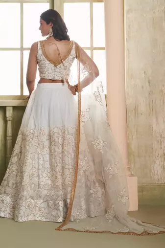 OFF WHITE NET FABRIC LAHENGA CHOLI WITH SEQUINS AND THREAD EMBROIDERY WORK