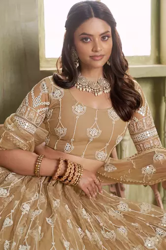 BEIGE NET FABRIC LAHENGA CHOLI WITH SEQUINS AND THREAD EMBROIDERY WORK