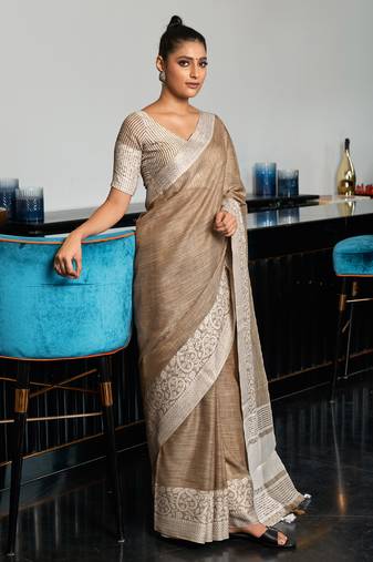 beige linen woven work traditional tassle saree