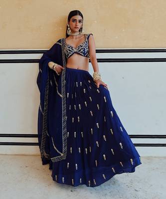 DEEP NECKLINE EMBROIDERED SLEEVELESS BLOUSE WITH FLORAL BUTTI EMBROIDERED LEHENGA AND DUPATTA 1