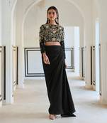 Black full sleeve big flower jaal embroidered crop top with cowl skirt.
