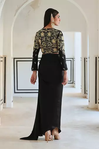 Black full sleeve big flower jaal embroidered crop top with cowl skirt.