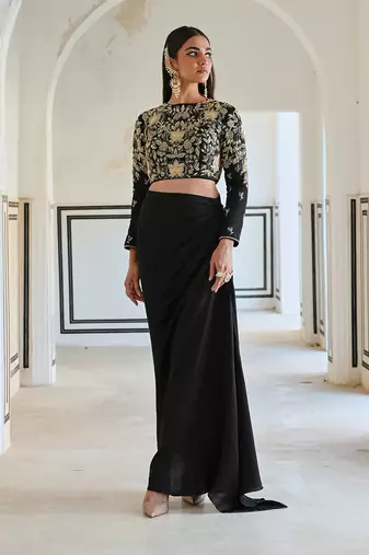 Black full sleeve big flower jaal embroidered crop top with cowl skirt.