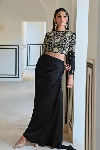 Black full sleeve big flower jaal embroidered crop top with cowl skirt.