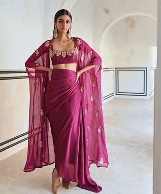 Magenta floral embroidered neckline bralet with floral butti embroidered jacket and cowl skirt. 1