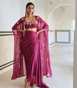 Magenta floral embroidered neckline bralet with floral butti embroidered jacket and cowl skirt.