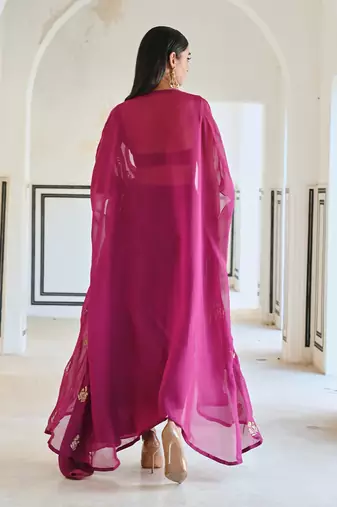 Magenta floral embroidered neckline bralet with floral butti embroidered jacket and cowl skirt.