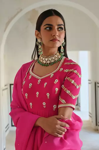 Rose pink raglan sleeve butti embroidered peplum with dhoti and dupatta.