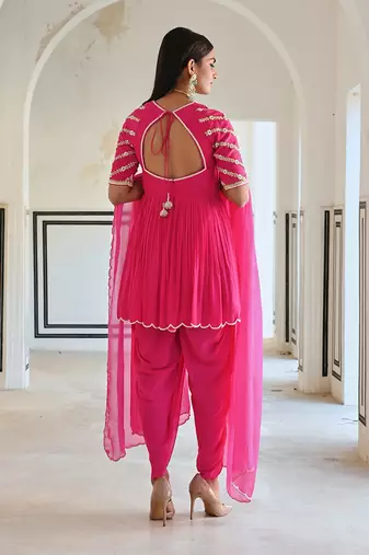 Rose pink raglan sleeve butti embroidered peplum with dhoti and dupatta.