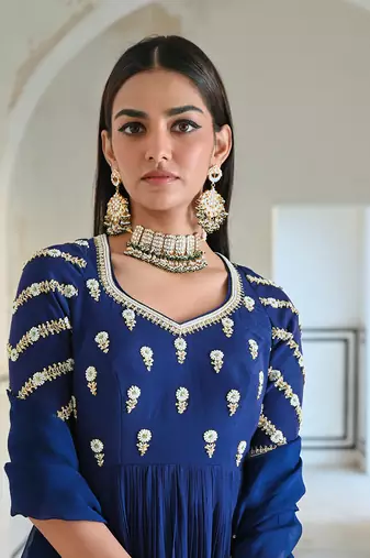 Royal blue raglan sleeve butti embroidered peplum with dhoti and dupatta.