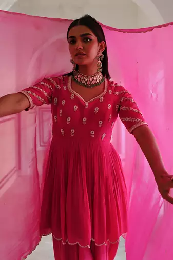 Rose pink raglan sleeve butti embroidered peplum with dhoti and dupatta.