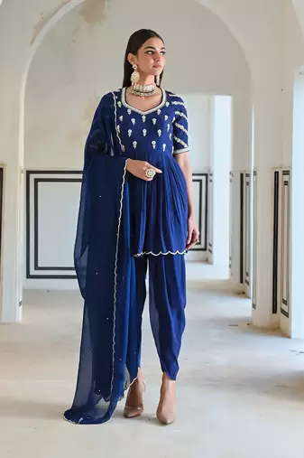Royal blue raglan sleeve butti embroidered peplum with dhoti and dupatta.