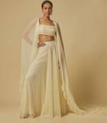 Yellow heavy embroidered gharara with blouse and ruffle cape