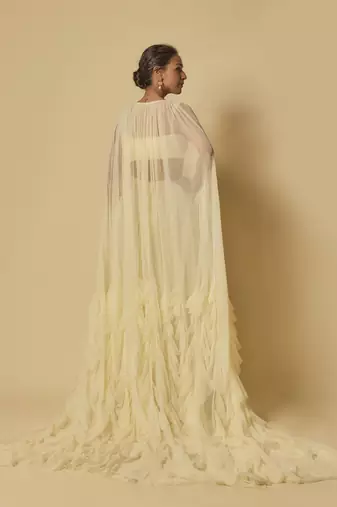 Yellow heavy embroidered gharara with blouse and ruffle cape