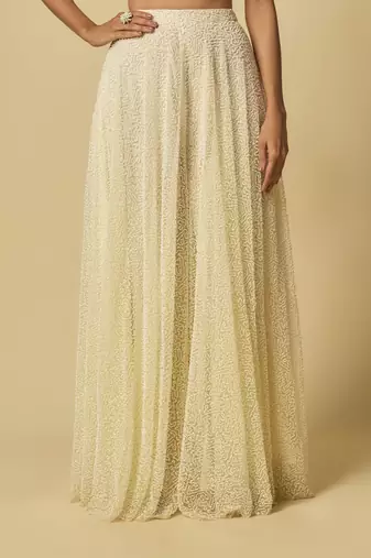 Yellow heavy embroidered gharara with blouse and ruffle cape
