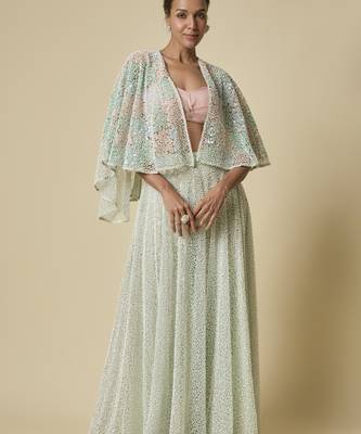Mint heavy gharara pant with peach blouse and mint embroidered cape 1