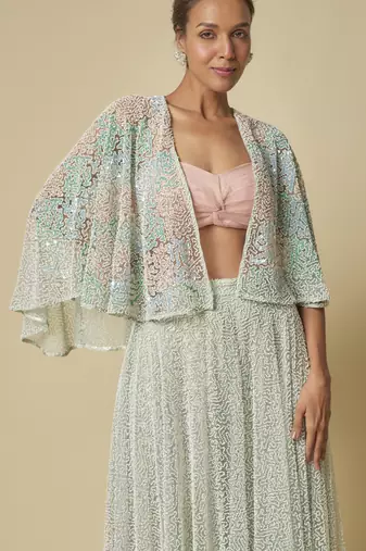 Mint heavy gharara pant with peach blouse and mint embroidered cape