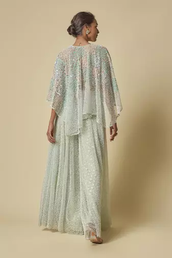 Mint heavy gharara pant with peach blouse and mint embroidered cape
