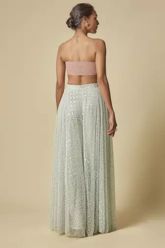 Mint heavy gharara pant with peach blouse and mint embroidered cape
