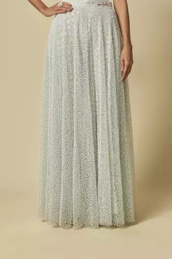 Mint heavy gharara pant with peach blouse and mint embroidered cape