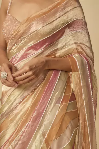Multi colour embroidered tissue and ombre pre-stitched saree with embroidered blouse