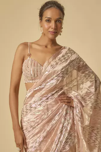 Pink tissue and.sequin block pre-stitched saree with embroidered blouse
