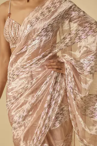 Pink tissue and.sequin block pre-stitched saree with embroidered blouse