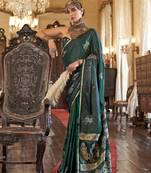 Luxurious dark emerald green satin silk saree with intricate weaving design